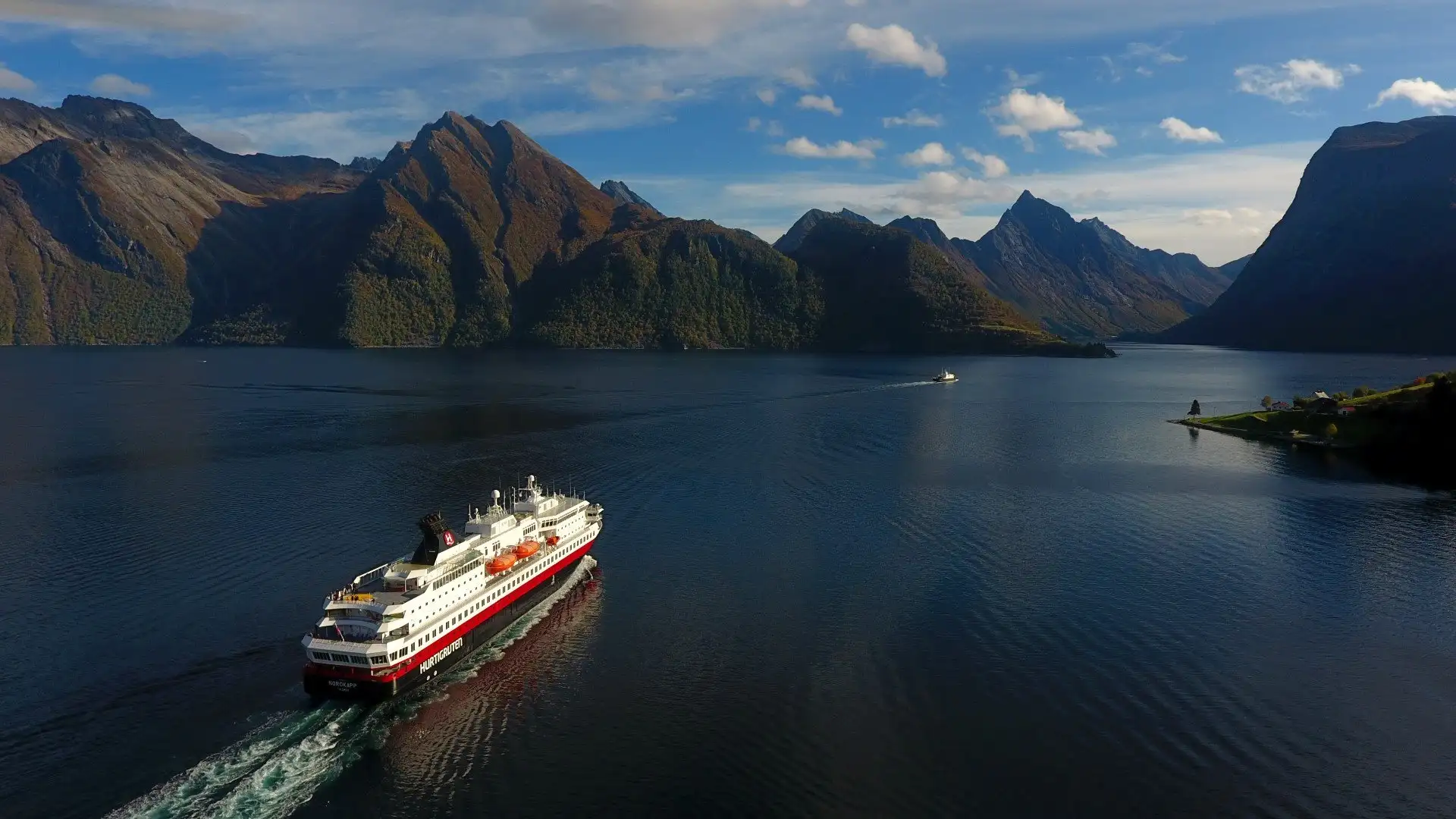 The Hjorundfjord under winter mountains