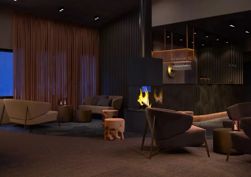Kuura lounge with seating arranged around a lit fireplace